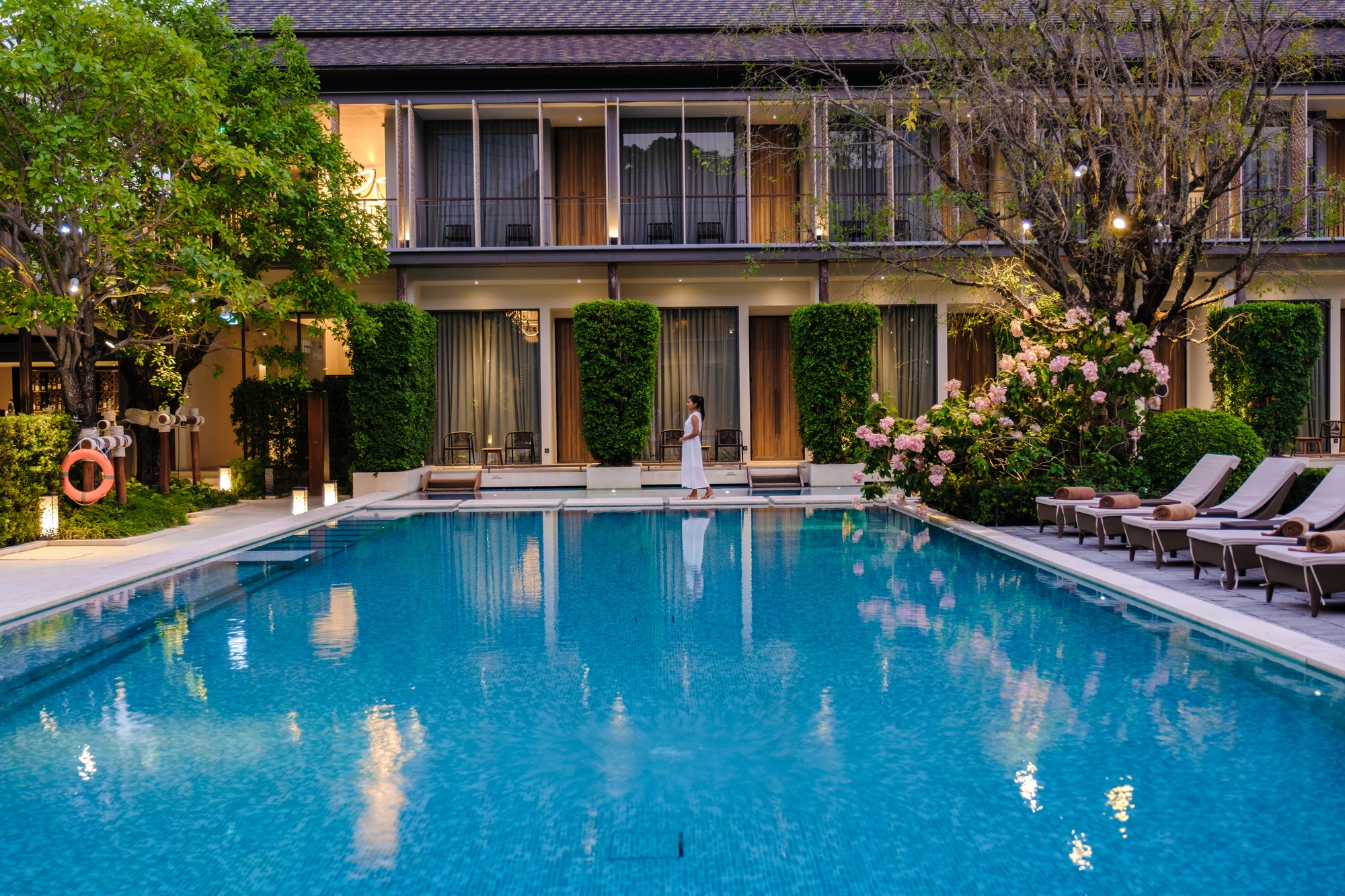 Asian women relaxing at a Luxury 5 star hotel pool in Asia