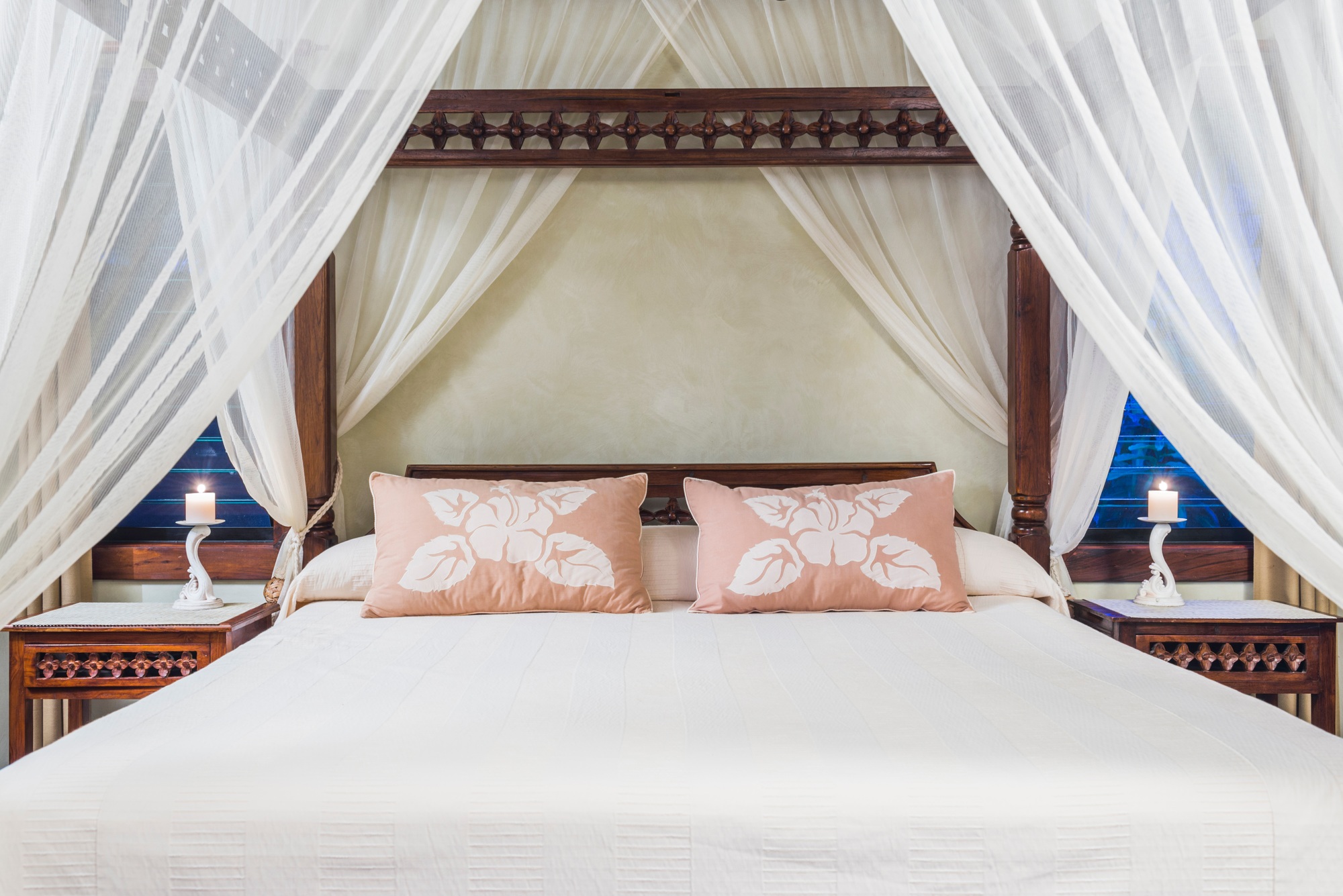 Luxury accommodation hotel bedroom details of a four poster bed with cushions